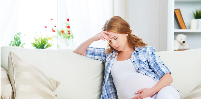 pregnant woman with  headache and pain