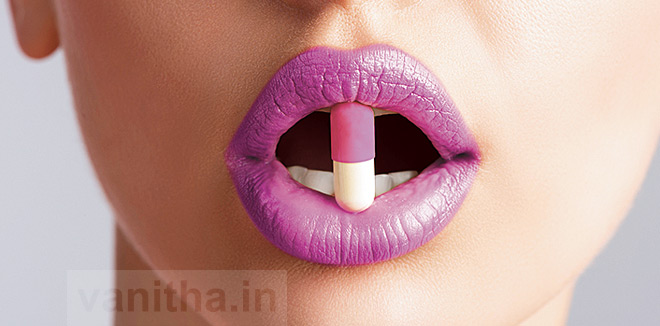 sexy female mouth with pill 