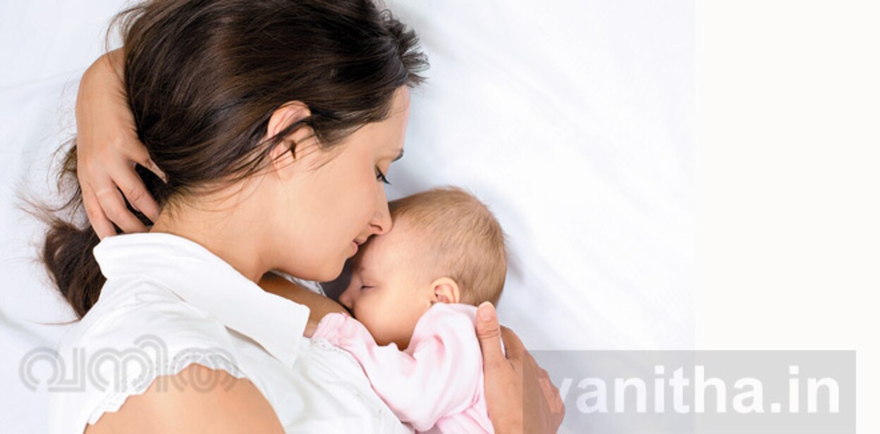 Happy Mother Breast Feeding Her Baby Infant