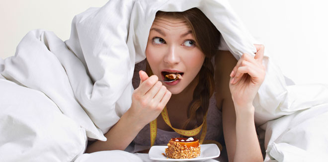 woman eating under cover