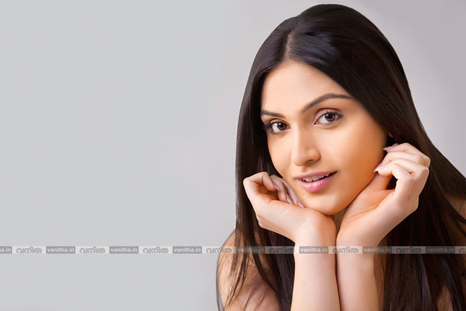 stock-photo-portrait-of-pretty-young-indian-woman-with-long-hair-isolated-over-colored-background-284216390