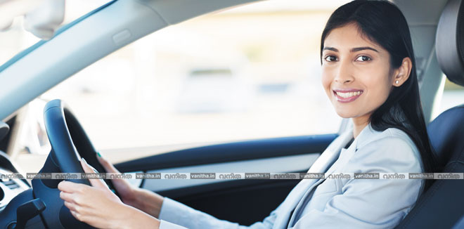 young indian businesswoman driving a car