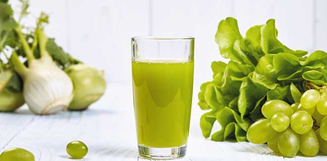Glasses with fresh vegetable juices isolated on white table. Detox diet. 